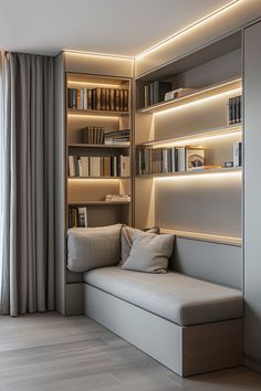 a living room filled with lots of furniture and bookshelves next to a window