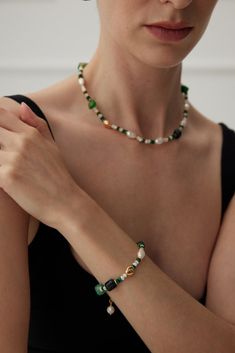 This multi-element bracelet features malachite, pearls and green onyx, among others, harmoniously blending together to create a beautiful accessory. Together, these diverse elements create a bracelet that effortlessly blends elegance, style and a touch of natural charm, making it a versatile and eye-catching addition to any jewelry collection. Metal: 18K Recycled Gold Plated Vermeil on Recycled Sterling Silver Gemstone: Malachite 4mm,Mother of Pearls 4mm,Green Onyx Pearl: Freshwater Pearls 6-10m Elegant Green Pearl Bracelet With Natural Stones, Elegant Malachite Beaded Bracelets For Gift, Elegant Green Beaded Bracelets With Natural Stones, Elegant Malachite Round Beads Bracelets, Elegant Handmade Malachite Bracelets, Elegant Malachite Bracelet Jewelry, Elegant Malachite Bracelet, Chain Making, Edison Pearls