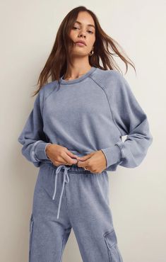 Relaxed fit Knit Denim French Terry: 85% Cotton, 15% Polyester Crew neckline Raglan sleeves Cropped length Mid-weight french terry Cheap Relaxed Fit French Terry Sweatshirt, Luxury Cotton Sweatshirt With Relaxed Fit, Luxury Washed Casual Sweatshirt, Luxury Casual Washed Sweatshirt, Cheap French Terry Sweatshirt For Winter, Denim Sweatshirt, Lounge Bra, Cropped Pullover, Knit Denim