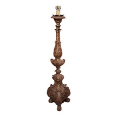 an ornate wooden candle holder on a white background