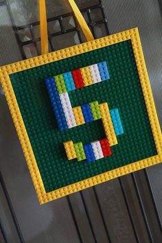 a lego tote bag hanging on a wall