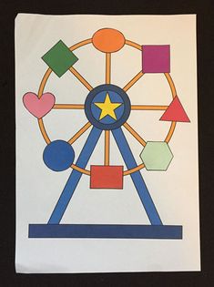 a drawing of a ferris wheel with different shapes and colors on it's side