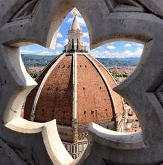 the dome of a building seen through a window