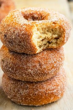 three sugar donuts stacked on top of each other