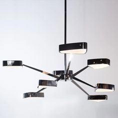 a modern chandelier hanging from the ceiling