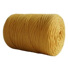 a roll of yellow thread on a white background