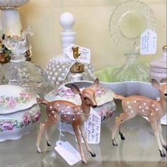 some deer figurines are on a table