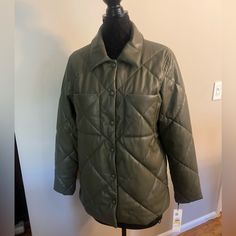 Sz M. Nwt. Olive Green Faux Leather. Very Soft. Quilted Pattern. Barn Style Jacket. Snap Front Closure. Two Front Open Patch Pockets. Measures Approx 21” Across Chest From Armpit To Armpit And 28” (Front) In Length From Top Of Shoulder To Hem. Back Is Approx 31” In Length. Comes From A Smoke Free Home. Faux Leather Jacket For Spring Cold Weather, Faux Leather Jacket For Spring And Cold Weather, Casual Quilted Leather Jacket For Spring, Calvin Klein Button Closure Fall Outerwear, Calvin Klein Fall Outerwear With Button Closure, Red Puffer Coat, Faux Suede Vest, Black Quilted Jacket, Beige Trench Coat