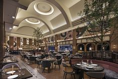 the interior of a restaurant with tables and chairs set up for formal dining in an elegant setting