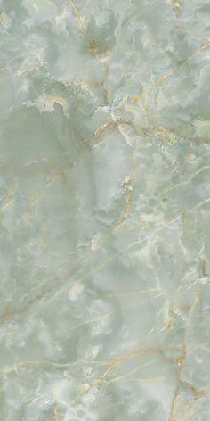 an abstract marble pattern with gold and white highlights on the top, as well as light green paint