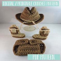 a crocheted hat, booties and mittens are arranged in the shape of a cowboy's hat