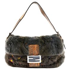 Rare Fendi baguette in fur color grey + python leather color orange, with embroidered multicolored mini stones, internal in silk color orange, silver hardware. Collector piece. Condition: Really good, to note: slight scratches on front logo. Packing/accessories: Dustbag. Measurements: 27cm x 15cm x 6cm Luxury Winter Shoulder Bag, Designer Evening Bags For Winter, Fendi Mini Bag, Fendi Fur, Fendi Mini, Sequin Bag, Fur Bag, Fendi Baguette, Baguette Bag