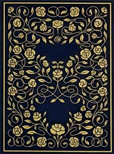 an intricately designed book cover with gold and black flowers on blue paper, in the shape of a cat's head