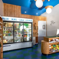 a store filled with lots of different types of drinks and beverages in it's display cases