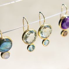 Limited Edition Elevate your everyday look with our Color Block Drops Earrings, inspired by the joyful art of mixing vibrant colors. Crafted with genuine semi-precious gemstones, these earrings are a playful yet sophisticated addition to your jewelry collection. Their unique design features a harmonious blend of hues, making them versatile enough to complement any outfit, whether you're dressing up for a night out or adding a pop of color to your casual attire. Lightweight and comfortable, the C Modern Purple Gemstone Earrings, Modern Amethyst Gemstone Earrings, Round Amethyst Earrings With Natural Stones, Multi-stone Blue Topaz Earrings As Gift, Fine Jewelry Earrings With Natural Stones, Blue Topaz Briolette Gemstone Earrings, Everyday Briolette Gemstone Earrings, Joyful Art, Blue Topaz Stone