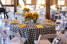 the tables are decorated with black and white checkered tablecloths, yellow napkins, and sunflowers