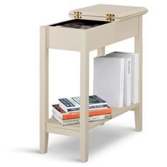 a small table with books on it and an open drawer in the bottom shelf for storage