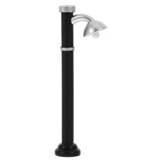 a black pole with a white light on top and a silver lamp in the middle