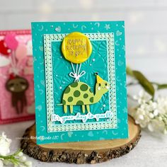 a card with a giraffe and balloon on it