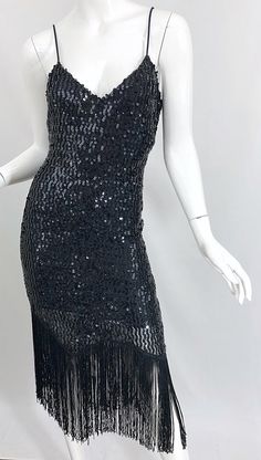 Black Flapper Sequin Party Dress, Black Flapper Sequin Dress For Party, Glamorous Black Sequined Flapper Dress, Flapper Style Sequin Evening Dress, Flapper Style Evening Sequin Dress, Glamorous Black Flapper Dress With Fringe, Glamorous Black Beaded Fringe Flapper Dress, Vintage Black Sequin Party Dress, White Jersey Dress