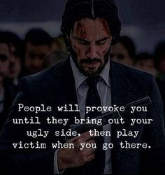 a man in a suit and tie holding a cell phone with the words people will prove you until they bring out your ugly side, then play victim when you go there