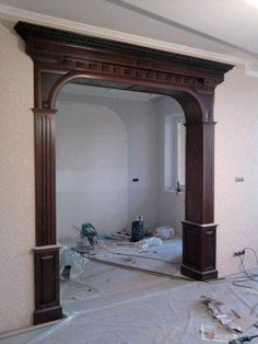 a room that is being remodeled with wood trimming