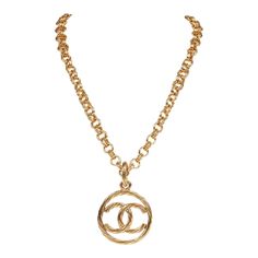 This vintage 93P necklace is in gold plated metal featuring a classic encircled CC pendant, long link chain, and a springring closure. Origin: France Condition: Vintage; Excellent - this necklace shows mild signs of wear, including light brushing, faint pitting, and some areas of patina. Accompanied by: Chanel box Measurements: 28" chain, 1.8" pendant Necklace Gold Chanel, Chanel Cc Necklace Gold, Chanel Box, Signature Quilts, Gold Long Necklace, Chanel 2, Brushing, Vintage Chanel, Classic Flap