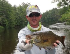 a man holding a large fish in his hands