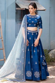 Blue lehenga with embroidered floral motifs. Comes with blouse and sheer dupatta.
Components: 3
Fabric: Raw silk, Net
Neckline: Round
Sleeve Length: Elbow
Color: Blue
Embroidery
Hand embroidery
Embroidered floral motifs on blouse
Embroidered floral motifs on dupatta
Side tassel tie-up detail on lehenga - Aza Fashions Blue Anarkali Lehenga With Intricate Embroidery, Blue Floor-length Embroidered Designer Fabric, Festive Blue Sets With Intricate Embroidery, Indigo Navratri Set With Dupatta, Indigo Sets With Dupatta For Navratri, Blue Floor-length Resham Embroidered Fabric, Blue Floor-length Fabric With Resham Embroidery, Blue Embroidered Floor-length Fabric For Festive Occasions, Festive Floor-length Blue Embroidered Fabric