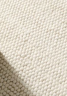 a close up view of a mattress with white circles on it