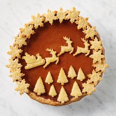 a pie with christmas decorations on it