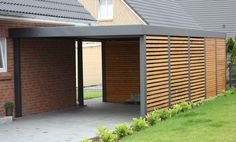 an open garage door on the side of a house