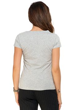 This women's T-shirt with a v-neck is the essence of elegance and minimalism. It comes from the BASIC collection, characterized by timeless design and wearing comfort. This classic t-shirt offers a slightly waisted cut that emphasizes a subtly feminine silhouette. Made from the highest quality materials, the t-shirt is extremely pleasant to the touch and guarantees all-day wearing comfort. The classic v-neck adds a touch of delicacy, making it an ideal choice for both casual and more formal occasions. It is a perfect base for many outfits, combining both with jeans, skirt or elegant pants. Women's t-shirt from the BASIC collection is an option for women who appreciate simplicity and classics. Add the t-shirt to your closet to create elegant yet comfortable styling for any occasion. Cotton Gray Relaxed Fit V-neck T-shirt, Basic Gray V-neck Tops, Trendy Gray V-neck T-shirt, Comfortable Gray V-neck T-shirt, Gray V-neck T-shirt For Everyday, Relaxed Fit V-neck T-shirt, Gray Everyday V-neck T-shirt, Everyday Gray V-neck T-shirt, Fitted Cotton V-neck Top With Short Sleeves