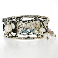 From Porans collection ----> Unique Silver Cuff bracelet- Silver coin, Silver Leaf & 9 freshwater pearls dangling. Flexible and can fit any wrist. Dimensions: Max Width: 27 mm\ 1.08 inches Please contact me with any questions. our jewelry shop on Etsy: http://www.etsy.com/shop/Porans Thank you for Visiting Our shop!Please visit my shop policies for additional information Bohemian Silver Jewelry, Red Garnet Earrings, Red Jewelry, Bohemian Bracelets, Silver Chain Bracelet, Sterling Silver Cuff Bracelet, Silver Coin, Sterling Silver Cuff, Silver Cuff Bracelet