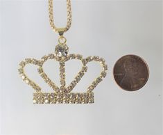 Gold or Silver Jewel Encrusted Crown Pendant, These crown necklaces are perfect for all royalty with all their rhinestones. They would make an exceptional gift for a fashionista. They are exquisite and would make an excellent charm or just as a collectible for the designer at heart. The are about 1.5 in x 2 in and they come with a 28" chain. Crown Design Pendant Jewelry As Gift, Classic Crown-shaped Jewelry As A Gift, Crown Gold Necklace, Silver Crown Necklace, Queen Necklace, Jewel Encrusted, Crown Pendant, Crown Charm, Crown Necklace