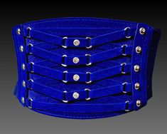 DEEP BLUE GLADIATOR BELT  Beautiful Jewel Tone Sapphire Blue faux velvet Belt with Silver Studs, Laces and Rhinestones. Front panel attaches to Wide stretchy Elastic that secures in back with 3 Snap faux velvet panel. SIZE: best fit Medium to Large, see measurements to confirm fit MATERIALS: Elastic, Faux Leather, Faux Velvet CONDITION: Excellent  MEASUREMENTS  Length 30"-38" Front Width 5" Back Width 4" SHIPPING Canada: shipping listed is for Expedited Mail. Tracking and insurance included, up to 7 business days for delivery. USA: shipping listed is for Air shipping with Tracking & Insurance. Up to 9 business days for delivery. INTERNATIONAL: Shipping is for Airmail. Tracking not included Returns not accepted for reasons of fit, only for missed damage. Please read the description and meas Velvet Belt, Cinch Belt, Stretch Belt, Suspender Belt, Sapphire Blue, Jewel Tones, Suspenders, Silver Studs, Cobalt Blue