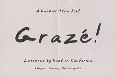 a piece of paper with the word graze written in black ink on it and an image of a handwritten font