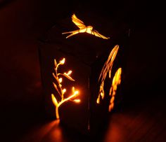 a light that is on top of a wooden table with some lights in the dark