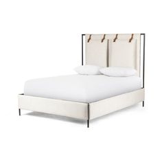 a bed with white linens and two pillows on it's headboard, in front of a white background