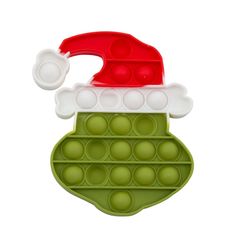 a green and red christmas pudding pan with santa hat on it's top, filled with balls