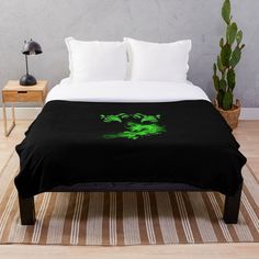 a bed with a black blanket on top of it