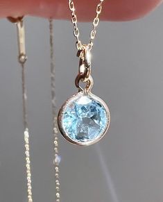 Wonderful natural aquamarine set in solid  14k yellow gold setting.  The gemstone sparkles beautifully and has a very good cut.  VVS clarity! This genuine aquamarine measures 4mm and weighs 0.60 carat. Total pendant weight is 0.35 grams Pendant length (including jump ring) - 15 mm *chain is not included The item shown in the photos is the exact item you will receive upon purchase. Double check dimensions and weight of item to make sure it meets your specifications before ordering. Each piece has Luxury Bezel Set May Birthstone Necklace, Aquamarine Pendant, March Birthstone, Yellow Gold Setting, Natural Aquamarine, March Birth Stone, Pendant Set, Necklace Bracelet, Aquamarine