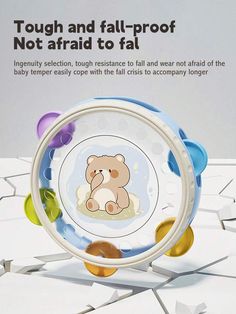 an advertisement for a baby toy with a teddy bear on it