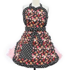 a dress on a mannequin with polka dots and pink flowers in the center