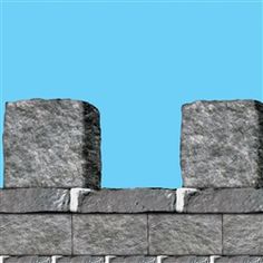 a blue sky is in the background behind a brick wall with two blocks on each side