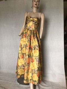 "Vtg 80s Victor Costa for Lord & Taylor, metallic brocade thread floral ballgown formal dress.10 Preowned. Condition 10/10. No visible flaws. Style. Strapless full length ballgown with ruched bodice, gathered at the waist to a full skirt. The metallic fabric is a wonderful gold colour with floral pattern in pinks and reds. Construction is exquisite. No expense spared. Very collectible and a fine example of this masterful example of USA fashion. Fully lined with boning in the bodice for comfort and support. Fastens at centre back zip. Best fit Aus 10  Go by measurements below dress laid flat  Underarm to underarm. 17\". 43cm Waist. 13\". 33cm Skirt length waist to hem.  40.75\". 103.5cm Length from top of zip to waist.  7.5\". 19cm My photos form an important part of the product description Spring Silk Ball Gown Evening Dress, Vintage Silk Evening Dress For Gala, Floral Print Ball Gown Evening Dress, Floral Print Formal Ball Gown Evening Dress, Formal Evening Ball Gown With Floral Print, Vintage Silk Maxi Dress For Evening, Vintage Evening Maxi Dress With Fitted Bodice, Vintage Maxi Dress With Fitted Bodice For Evening, Vintage Floral Print Maxi Dress For Evening