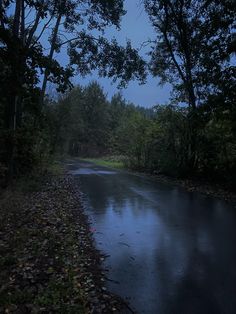 the road is dark and wet at night