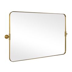 a gold framed mirror on a white wall with a metal frame and brass fittings