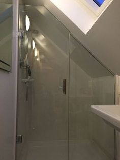 an image of a bathroom setting with glass shower door and sink in the corner on instagram