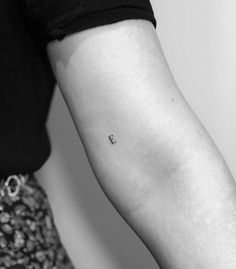 a person with a small tattoo on their arm